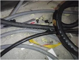 Cable offcuts and construction debris between server racks