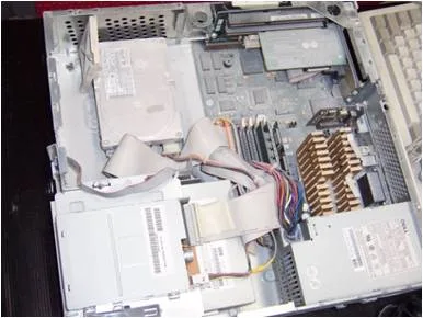 Desktop PC interior heavily contaminated with dust before cleaning