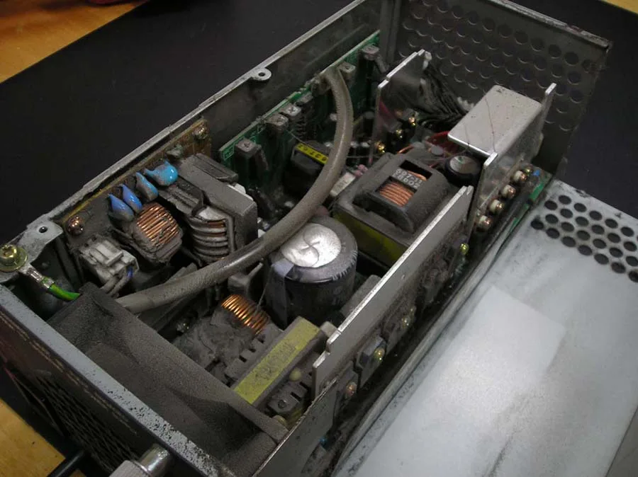 Power supply unit interior clogged with dust before cleaning