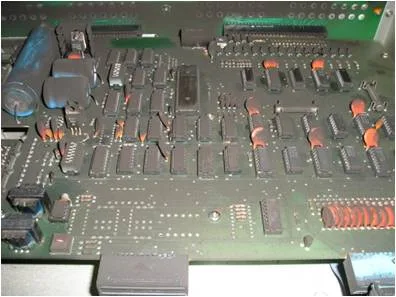 Rack-mounted equipment covered in fire suppression residue before cleaning