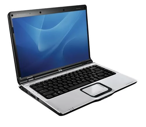 Laptop being professionally cleaned including cooling vents and keyboard